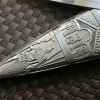 ornate scabbard tip