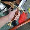 writhen hilt in hand